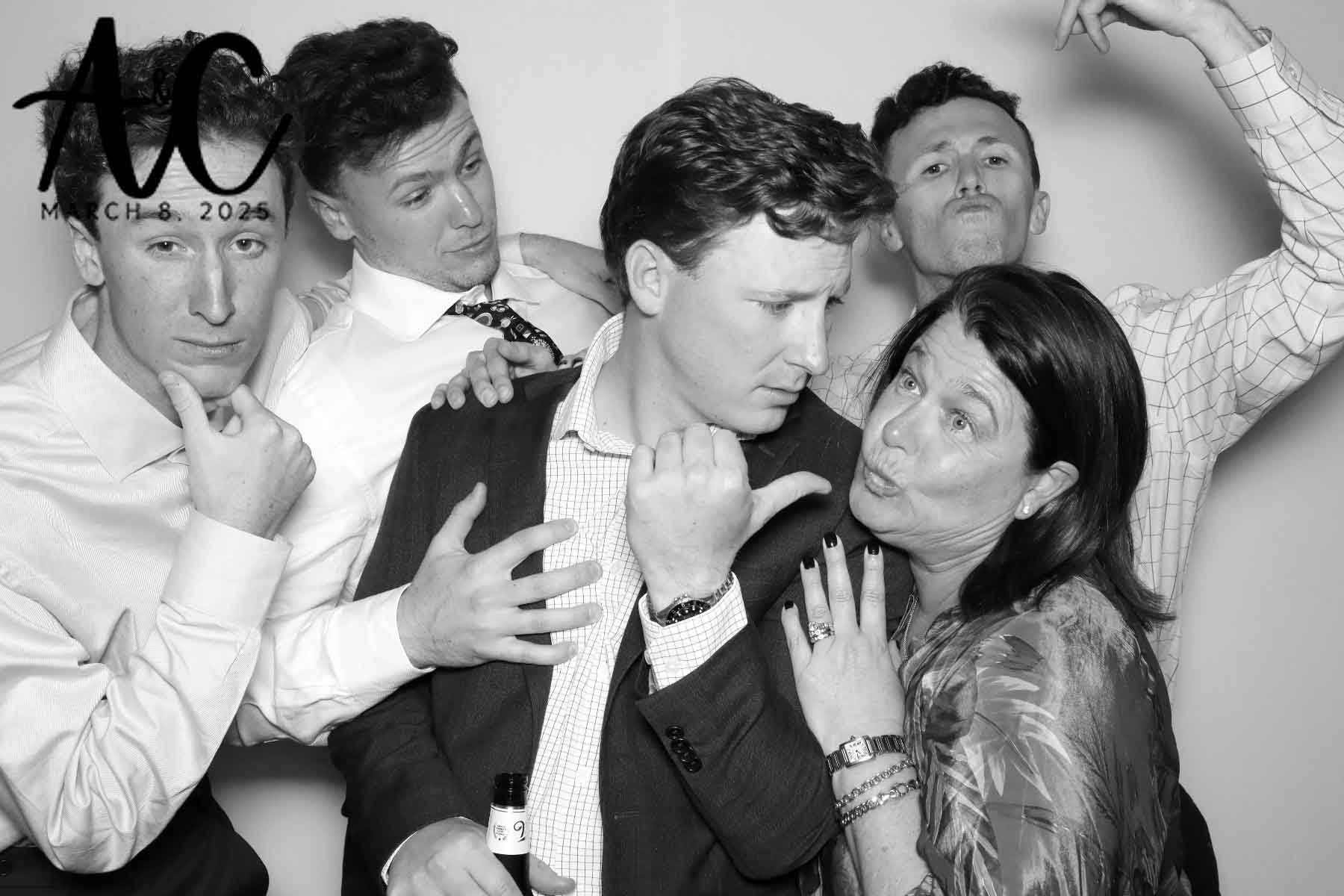 Five guests making silly faces at a wedding