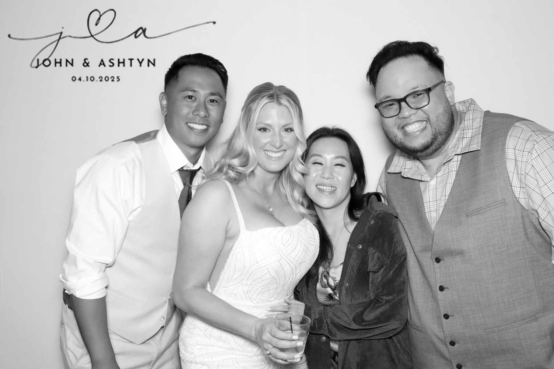 Bride and groom posing with two guests